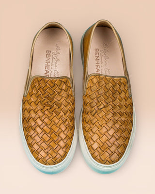 Top view of Iris unisex woven slip-on shoes in mahogany leather with white rubber soles.