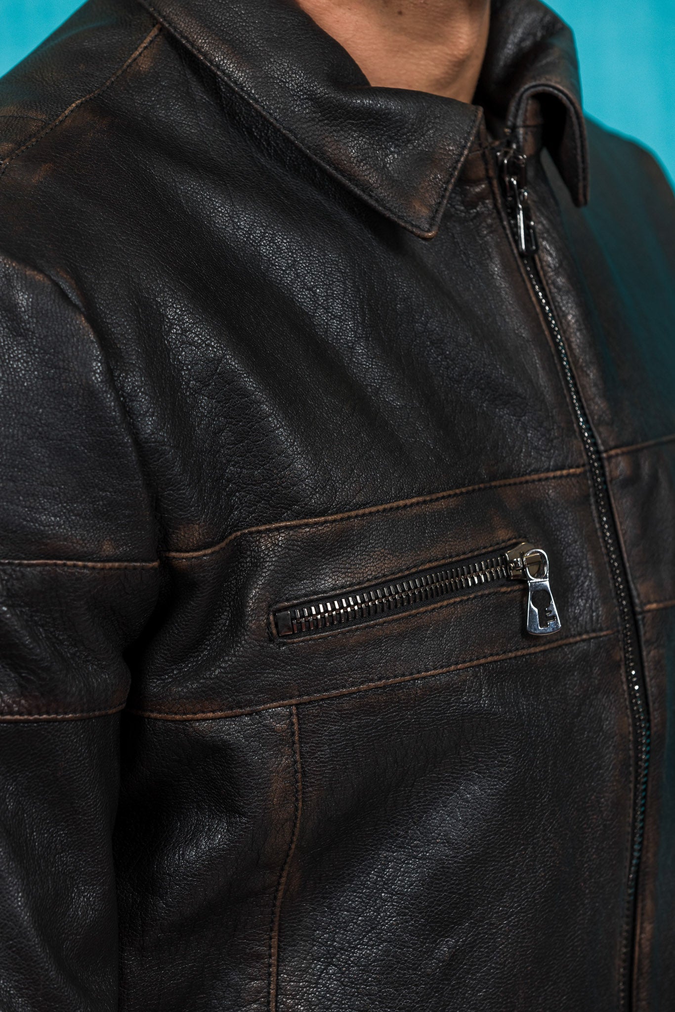 Detail of the front pocket zipper on the James Special goat leather jacket by Benheart.