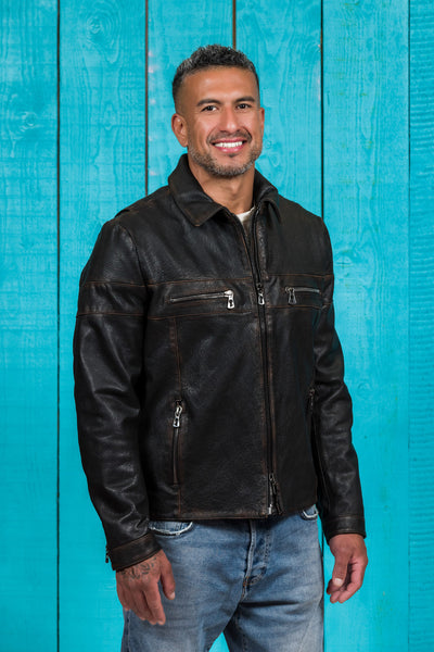 Front angled view of a model wearing the James Special goat leather jacket by Benheart, handcrafted in Florence, Italy, in black.