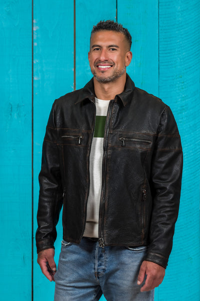 Model wearing the black James Special goat leather jacket by Benheart, shown in a three-quarter angle with the jacket open at the front.