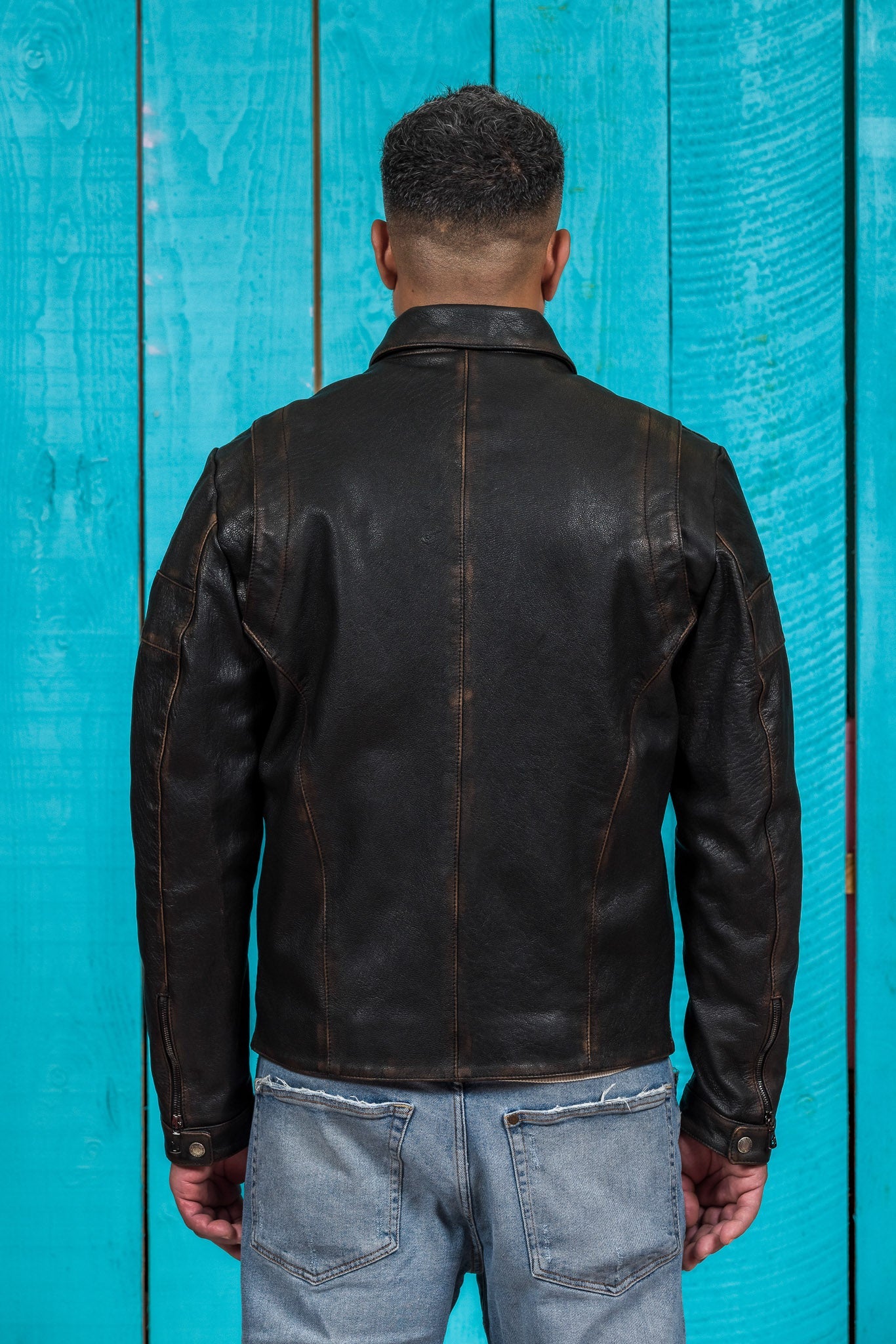 Model shown from the back wearing the black James Special goat leather jacket by Benheart, handcrafted in Italy.