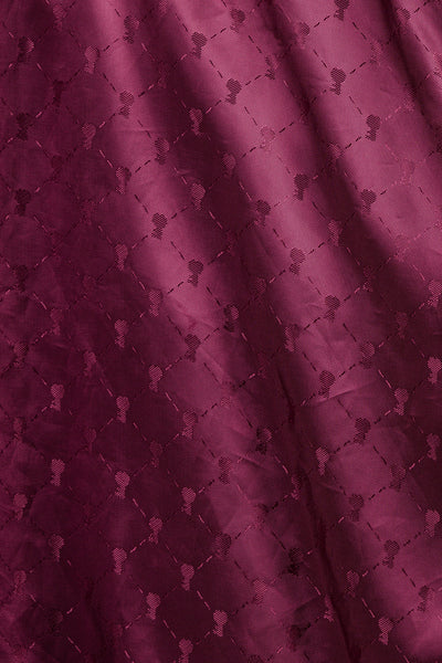 Detail of the red inner lining of the Jasmine leather jacket, featuring the heart-shaped key, a symbol of the brand.