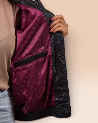 Close-up of the inner red lining and internal pocket of the Jasmine black leather jacket with Benheart logo.