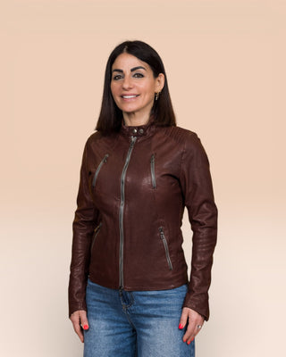 Lory women's brown leather biker jacket, worn closed by model, front 3/4 view.