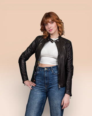 Model in Lory women's black leather biker jacket, front view, jacket open.