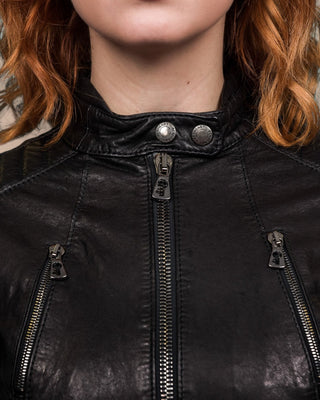 Lory women's black leather biker jacket, close-up of front and chest zippers with Benheart logo, collar closed.