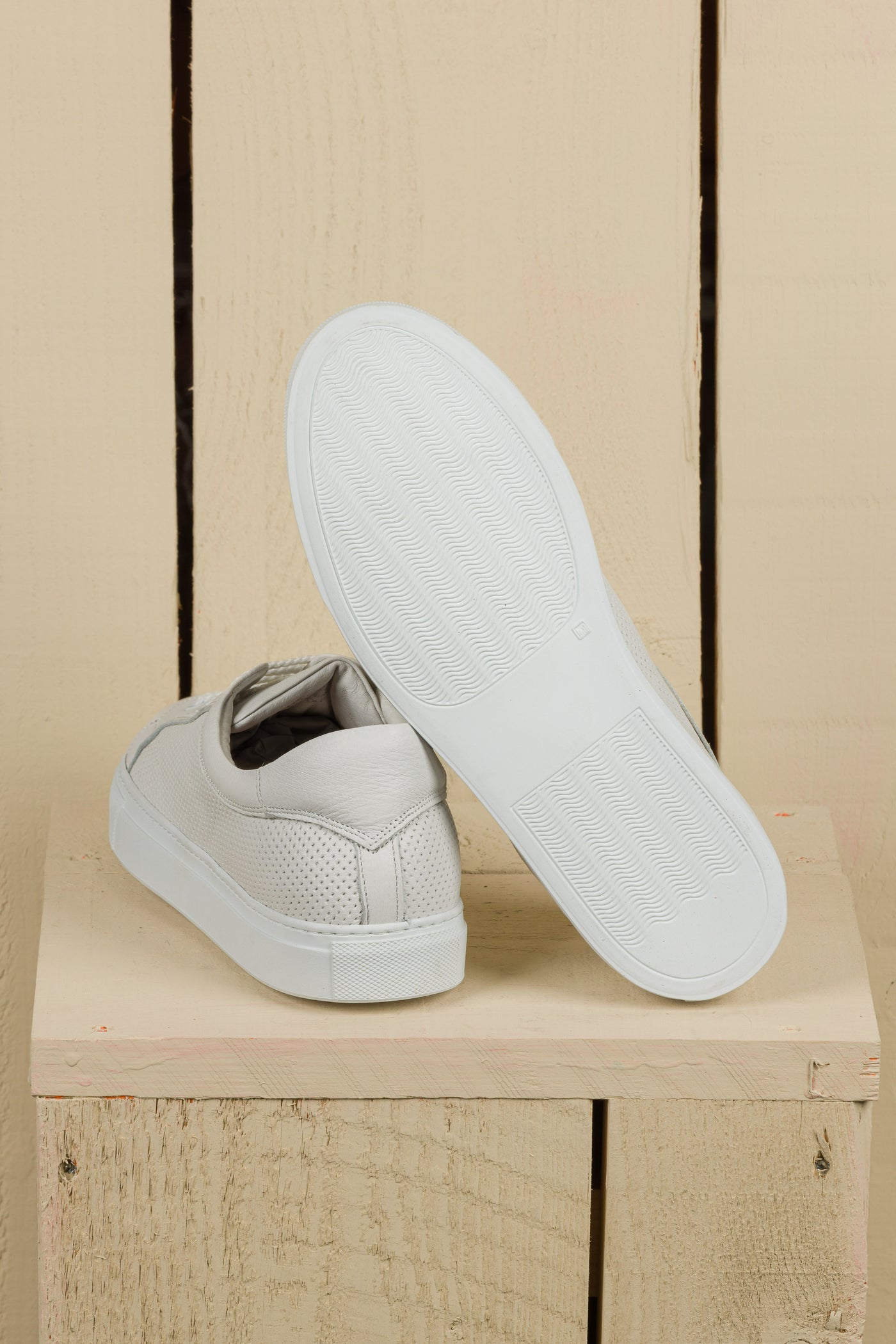 Rear view of Benheart Lario unisex perforated leather sneakers shoes in white color, rubber soles.