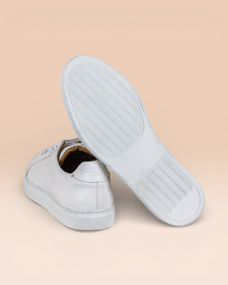 Benheart Leclerc men’s white leather low-top sneakers, rear view with one shoe showing the white rubber sole.