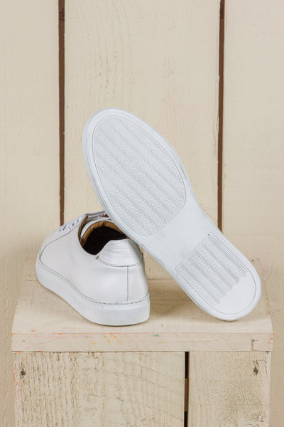Benheart Leclerc men’s white leather low-top sneakers, rear view with one shoe showing the white rubber sole.