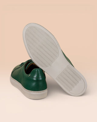 Benheart Leclerc men’s green leather low-top sneakers, rear view with one shoe showing the white rubber sole.