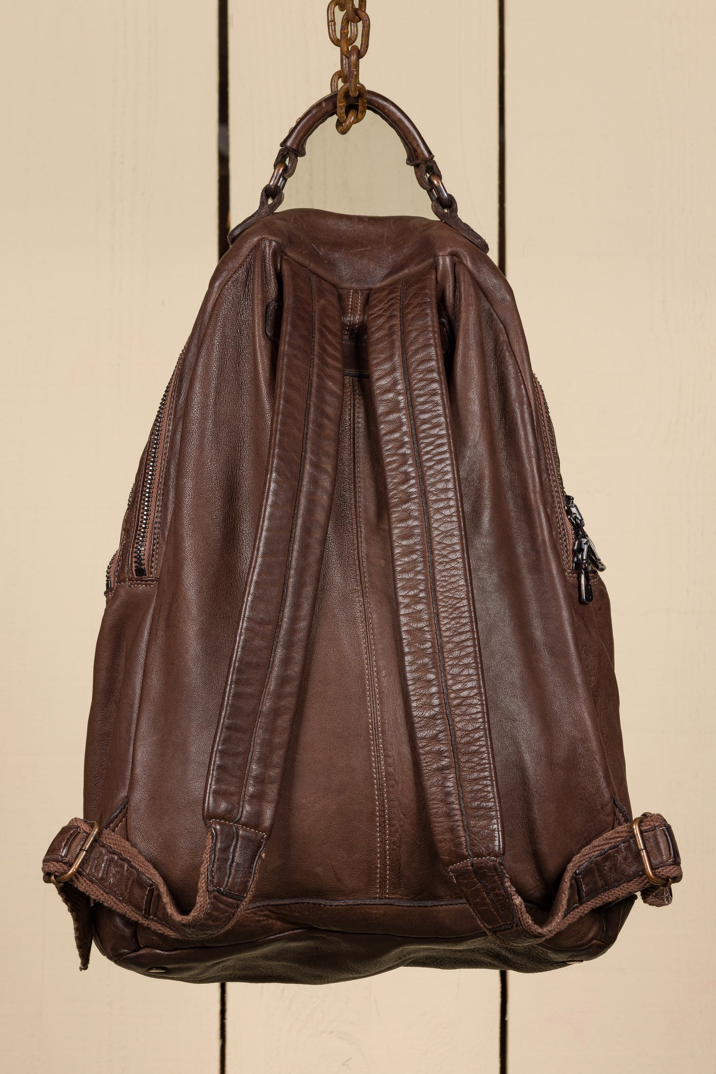 Benheart Lorenzo unisex leather backpack in brown, rear view showing adjustable shoulder straps.