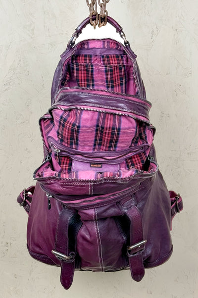 Benheart Lorenzo unisex leather backpack in plum, front view with open compartments showing interior.