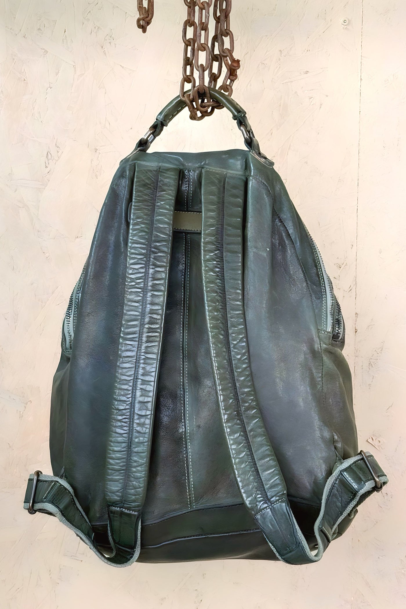 Benheart Lorenzo unisex leather backpack in green, rear view showing adjustable shoulder straps.