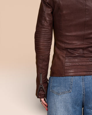 Back view detail of left sleeve on Lory women's brown leather biker jacket, showing Benheart logo zipper.