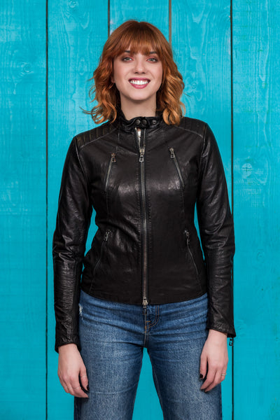 Front view of model in Lory women's black leather biker jacket, worn closed.