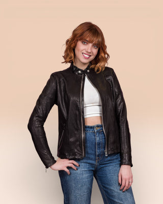 Model in Lucia women's black leather jacket by Benheart, front view, jacket open.