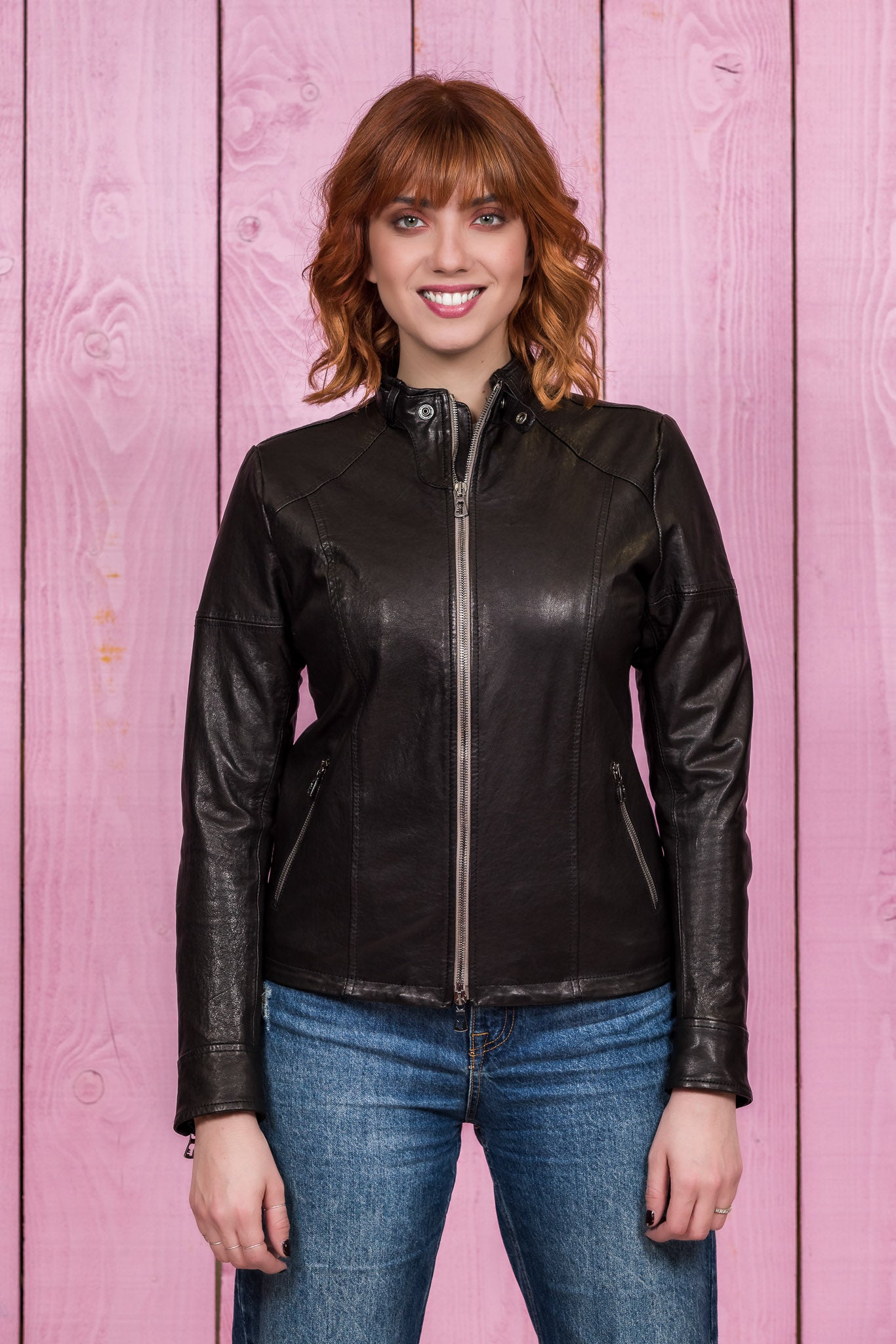 Front view of model in Lucia women's black leather jacket by Benheart, handmade in Italy, closed.