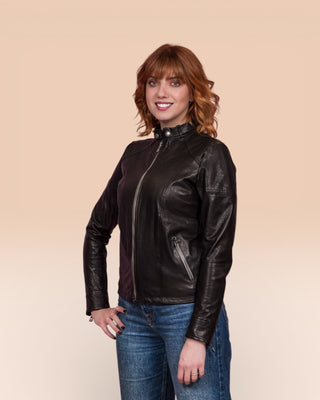 Lucia women's black leather jacket by Benheart, worn closed by model, front 3/4 view.