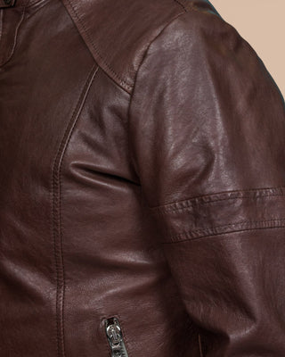Close-up of the stitching detail on the left shoulder of the Madison leather jacket by Benheart, in brown.