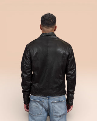 Rear view of a model wearing the Madison leather jacket by Benheart in black, handcrafted in Florence, Italy by Benheart.