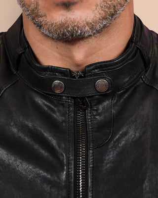 Close-up detail of the front of the Madison leather jacket by Benheart, showing the collar and zipper, in black.