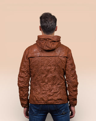 Back view of a model wearing the Michelangelo men's leather jacket in cognac, with hood, featuring Benheart’s signature handcrafted wrinkled finish.