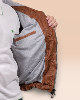 Detail of the Michelangelo men's leather jacket in cognac, shown open to reveal the inner lining and internal pocket.