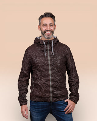 Model wearing a Michelangelo men's leather jacket with hood, in dark brown, handcrafted by Benheart in Florence, Italy.
