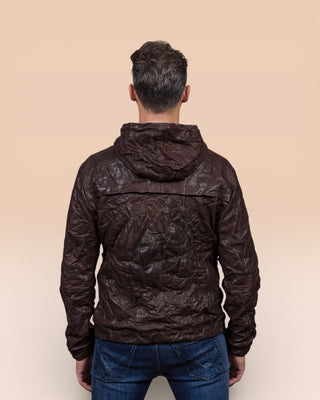 Back view of a model wearing the Michelangelo men's leather jacket in dark brown, with hood, featuring Benheart’s signature handcrafted wrinkled finish.