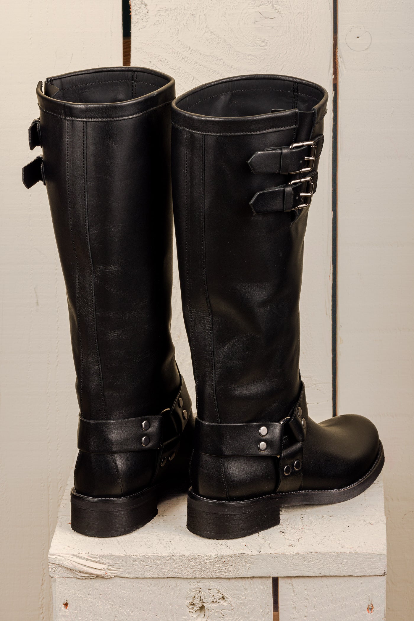 Benheart Maria 994 women's black leather boots with buckles and harness strap, rear view.
