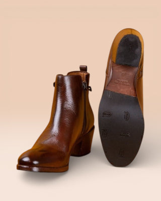 Benheart Miranda 5258 women’s brandy leather ankle boots with side zip, one boot front angled view and the other showing the sole