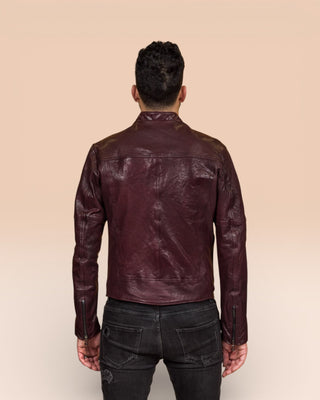 Back view of the NELSON Limited Edition leather jacket in plum color, worn by a model.