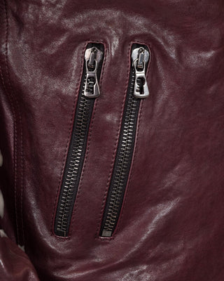 Close-up detail of the NELSON Limited Edition leather jacket in plum color by Benheart, showcasing the front zippers