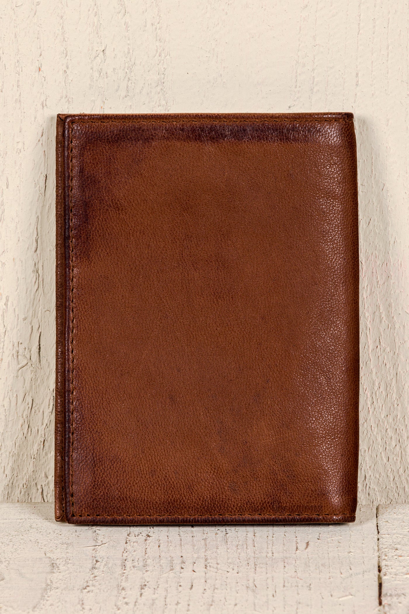 Back view of a New York leather wallet by Benheart in tan brown leather
