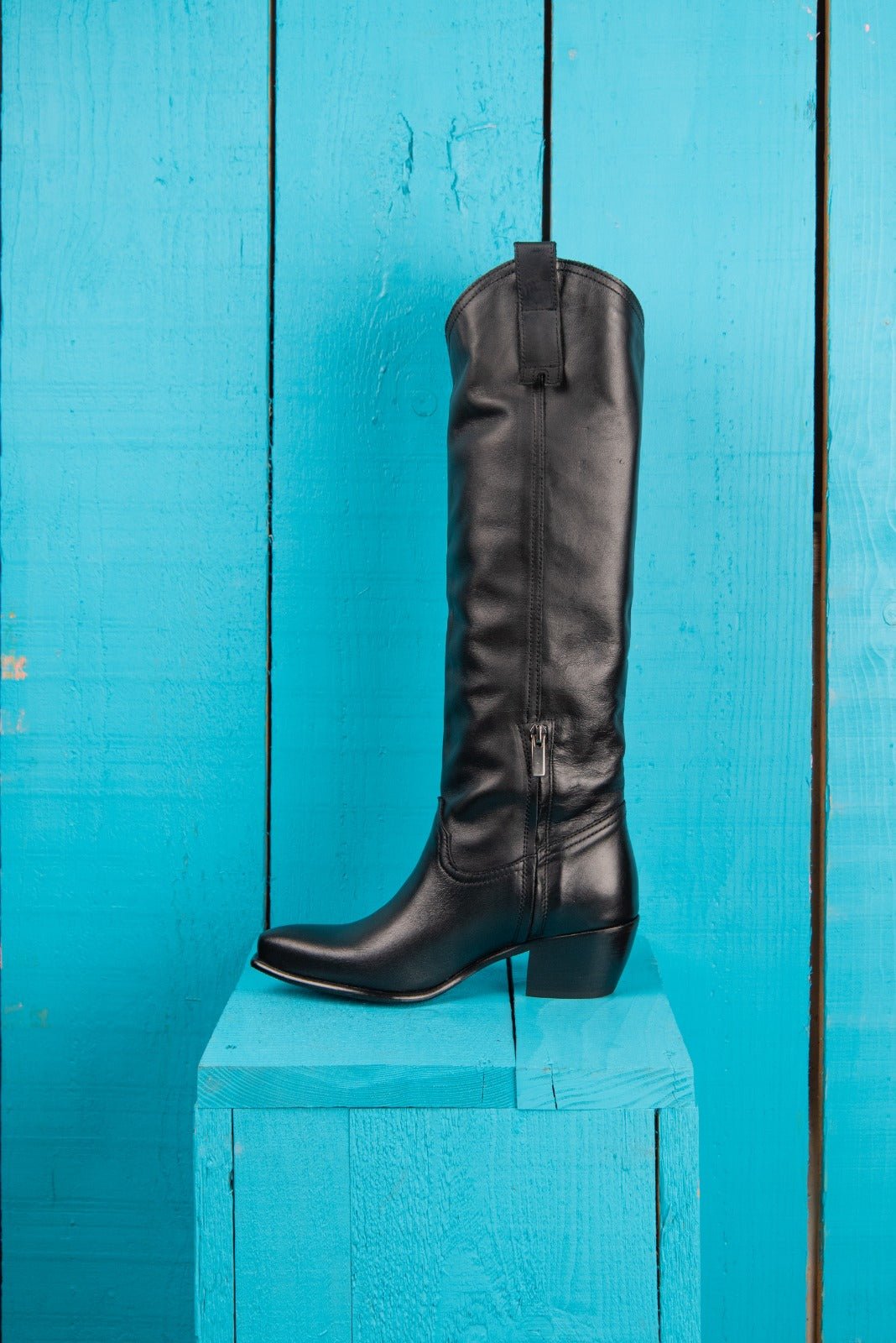 Side view of Novelli high texan boots by Benheart in black, featuring a side zip closure.