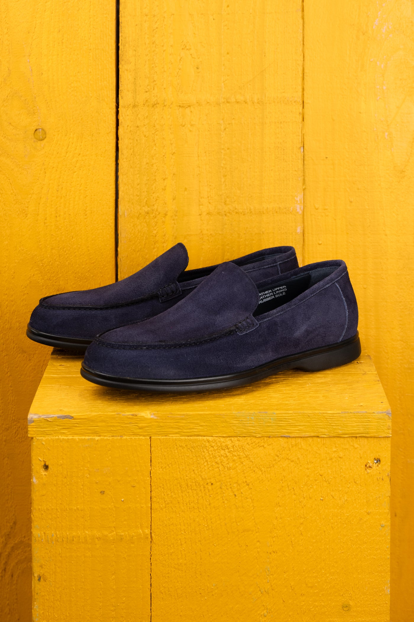 Benheart Nule men’s blue suede apron loafers with rubber sole, front angled view.