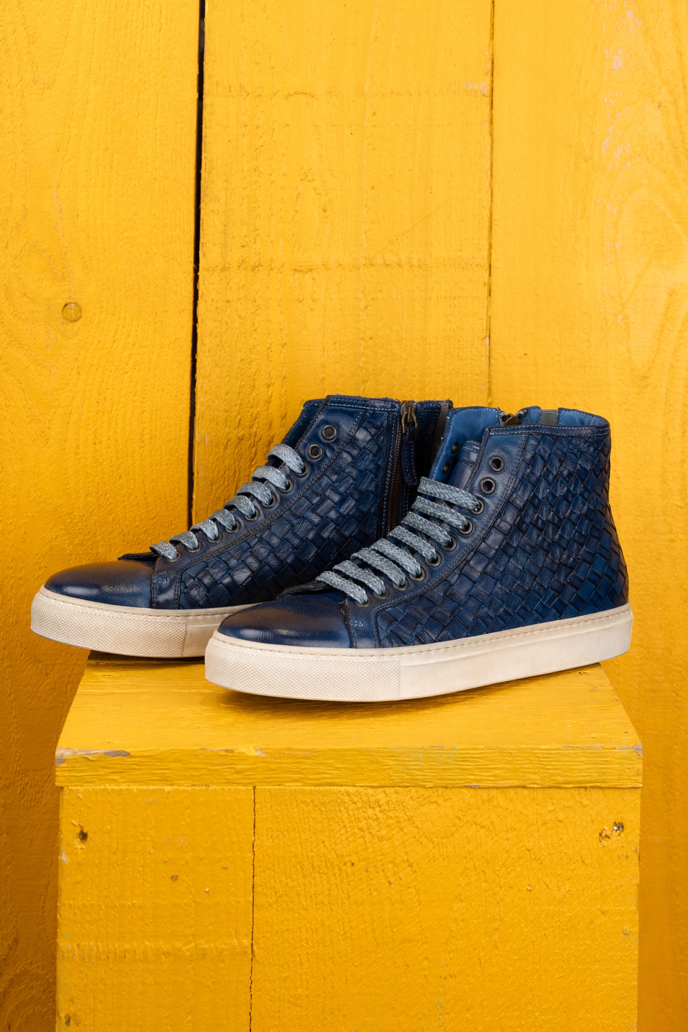 Front angled view of Raimondo 8393 unisex indigo woven high-top sneakers with rubber soles.