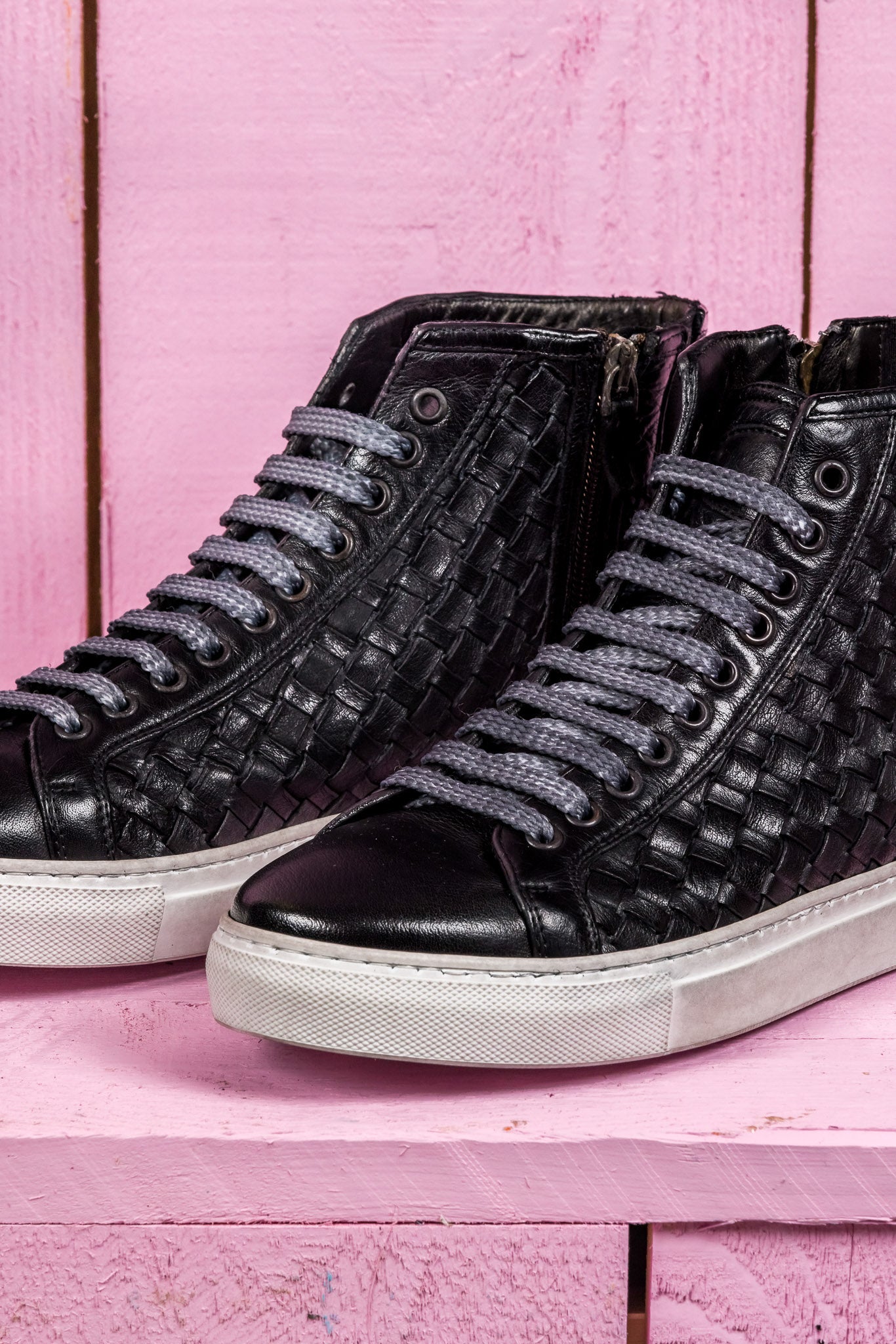 Close up view of Raimondo 8393 unisex black woven high-top sneakers with rubber soles.