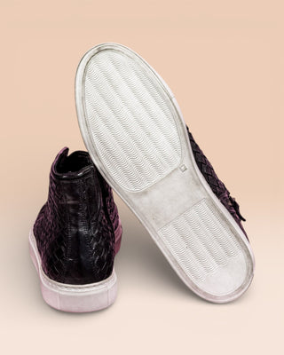 Rear view of Raimondo 8393 black woven leather high-top sneakers by Benheart, close-up of white rubber soles.