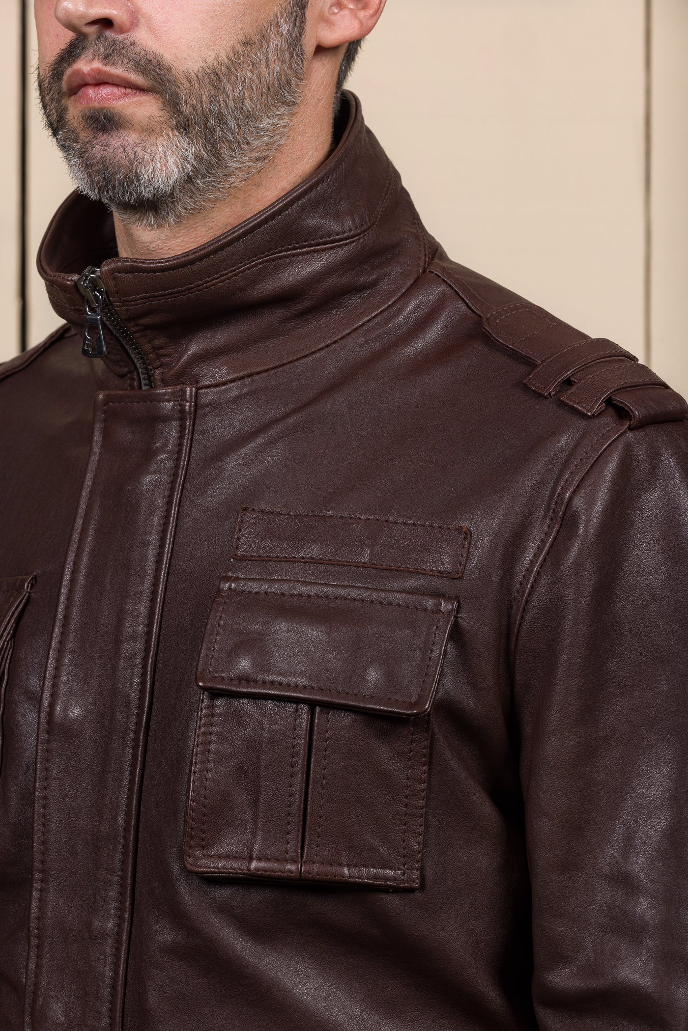Close-up of the left shoulder and chest pocket of the Simone jacket by Benheart, handcrafted in Italy from garment-dyed brown
