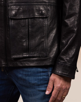 Close-up of the lower left front pocket of the Simone jacket by Benheart, handmade in Florence, Italy, in black.