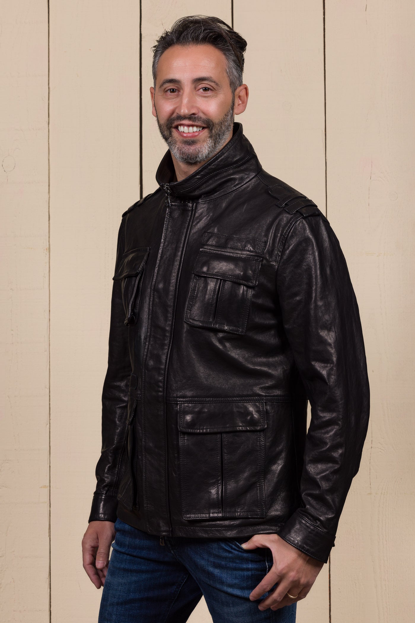 Front angled view of model wearing the Black Simone jacket by Benheart in leather, featuring four front flap pockets
