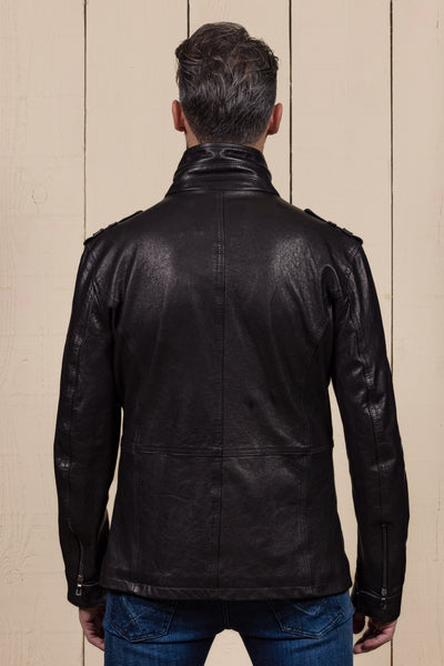 Back view of a model wearing the black Simone leather jacket by Benheart.