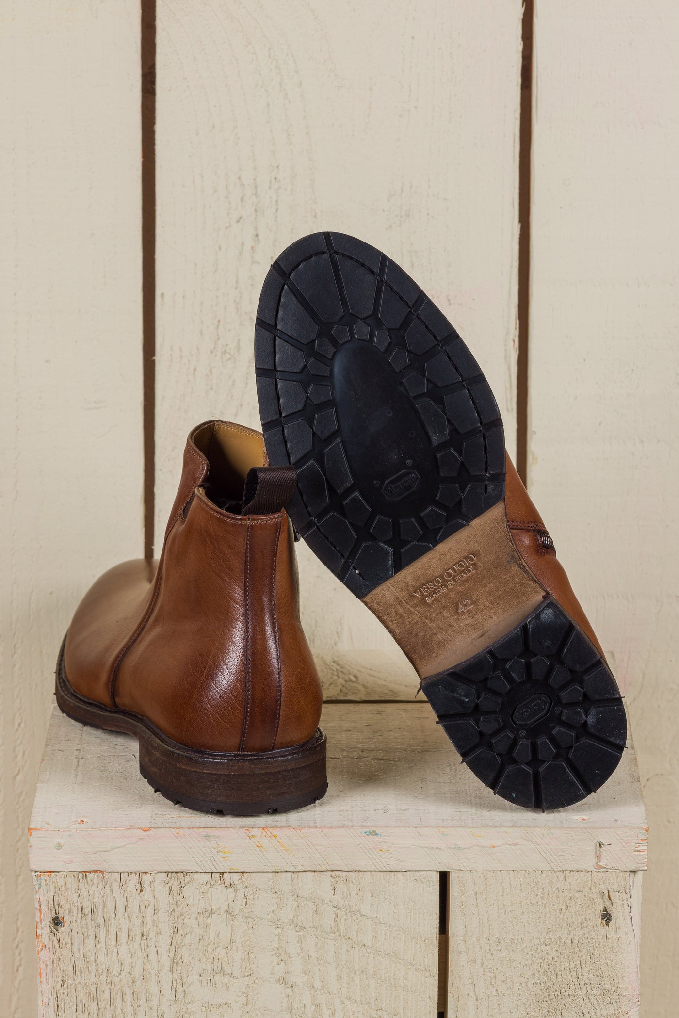 Rear view of Suso cuoio leather Chelsea boots, one turned to show Vibram soles.