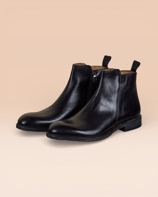 Front angled view of Benheart Suso men’s Chelsea boots in black leather with side zippers.