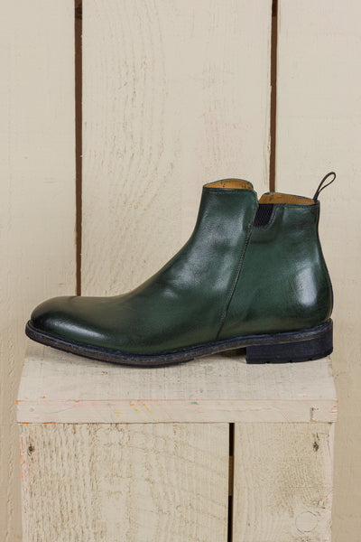Side view of Suso men’s green leather Chelsea boots with side zippers.