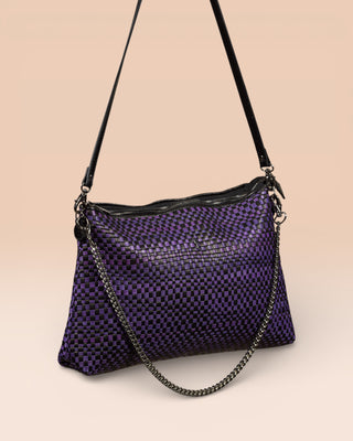 Benheart Violet Intrecciata black and violet handwoven leather bag, three-quarter rear view, woven leather pattern, chain and leather shoulder strap, zipper closure, luxury designer handbag for women.