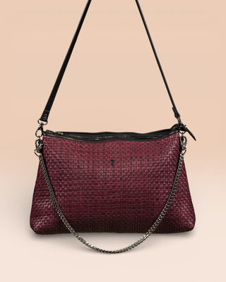 Front view of the Benheart Violet Intrecciata handwoven leather bag in plum, featuring a woven pattern, chain and leather shoulder strap, zipper closure.