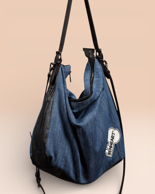 Front view of Venice Jeans denim and leather bag with Benheart logo patch.