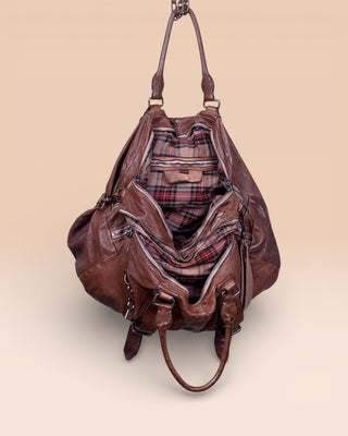 Open view of the Benheart Viaggio unisex cuoio leather travel bag, showing plaid fabric lining and internal compartments.